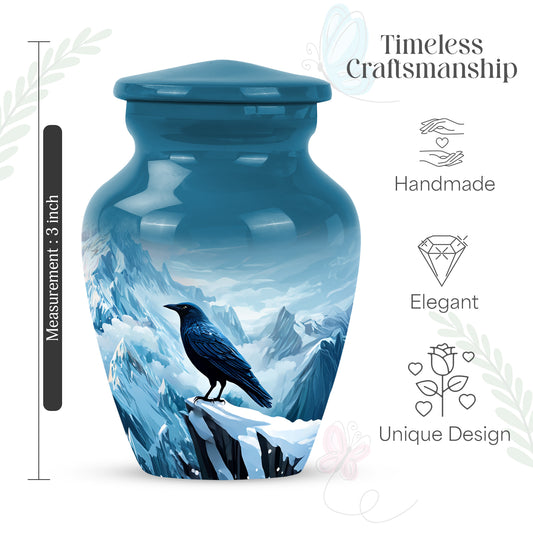 Dusty Blue Crow Cremation Urn close-up of engraving and surface detail - classic sculpted crow pattern on smooth aluminum - mini keepsake memorial for portion of cremation ashes