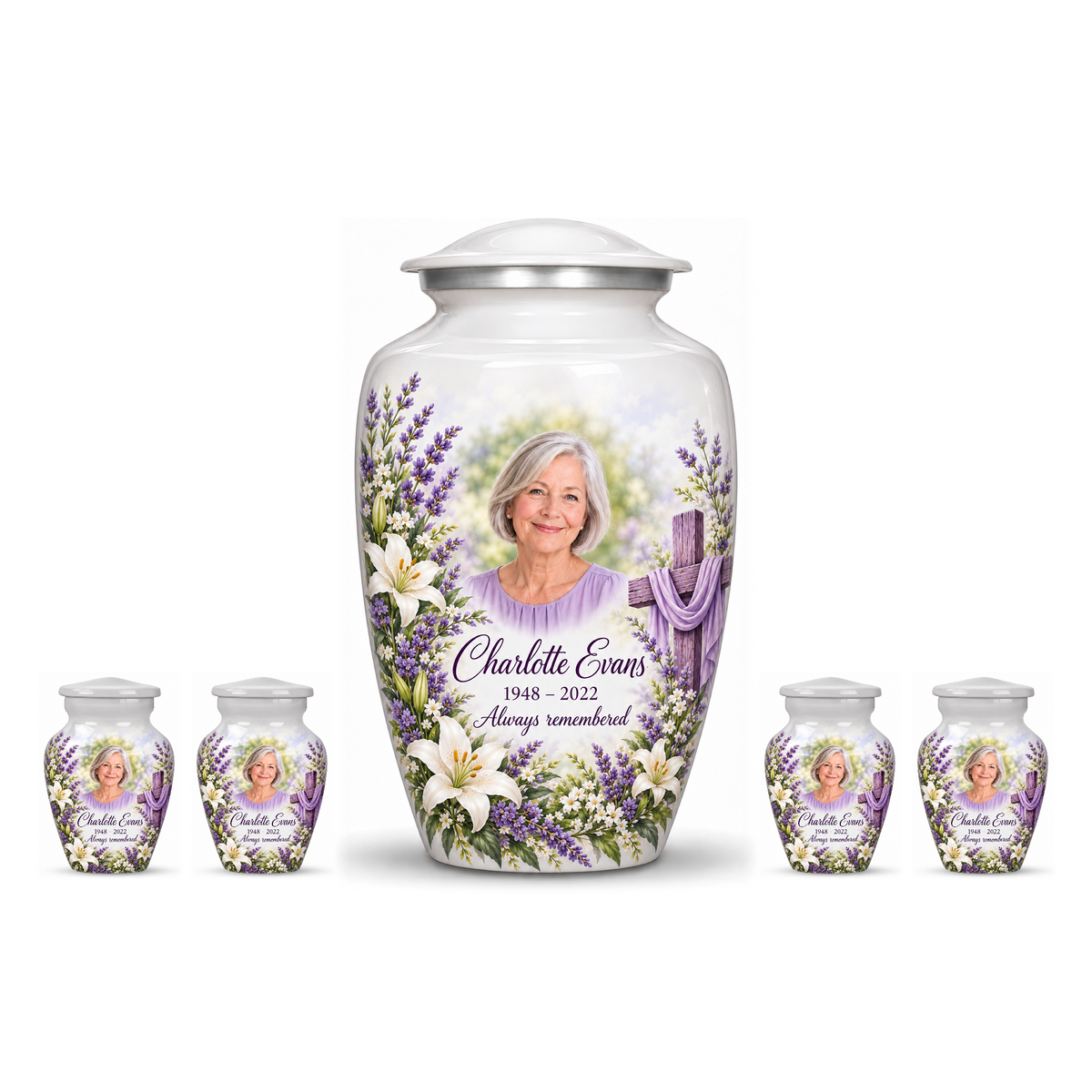 One white adult cross urn and four keepsakes with white lilies and lavender arranged on white.