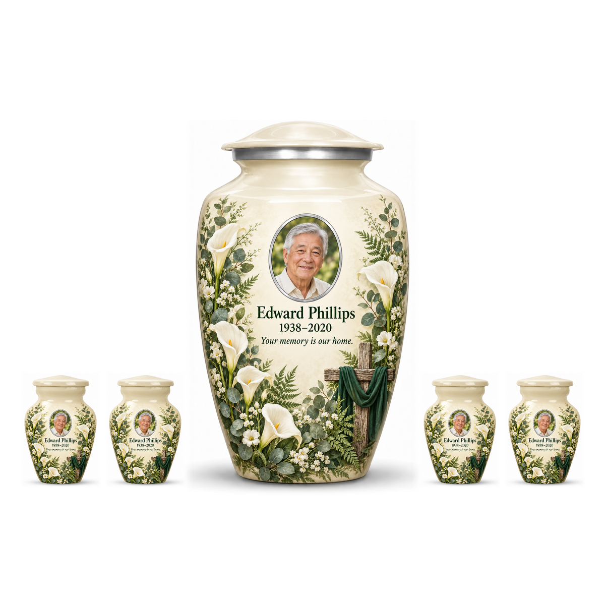 One white adult cross urn and four keepsakes with white calla lilies and greenery arranged on white.