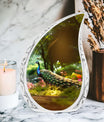 Classic 3-inch peacock memorial urn.