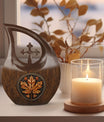 10 inch Mapple Leaf Urn with Cross Drop design, also a Cremation Vault