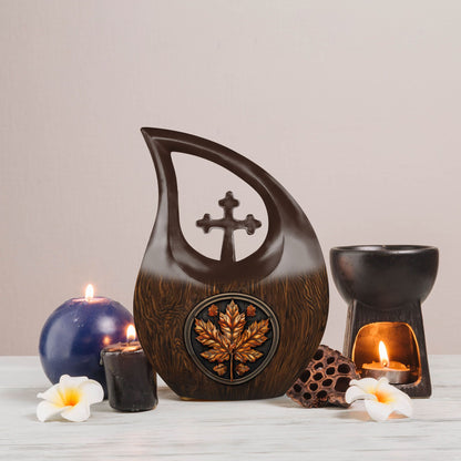 10 inch Mapple Leaf Urn with Cross Drop design, also a Cremation Vault