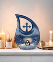 A unique Penguin themed Cross Drop Memorial Urn