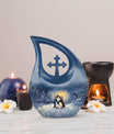 A unique Penguin themed Cross Drop Memorial Urn