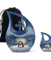 A unique Penguin themed Cross Drop Memorial Urn
