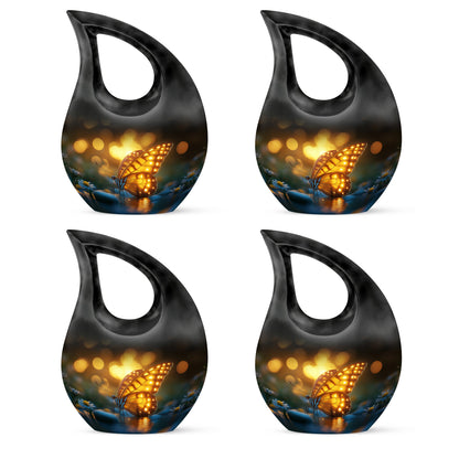 Obsidian Black Butterfly Cremation Urn lifestyle display on memorial shelf - devotional cross-drop butterfly engraving - 10 inch aluminum urn for cremated remains