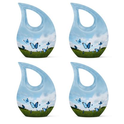 Azure Butterfly Cremation Urn lifestyle display on memorial shelf - cross and butterfly combined in spiritual memorial design - 10 inch aluminum urn for cremated remains