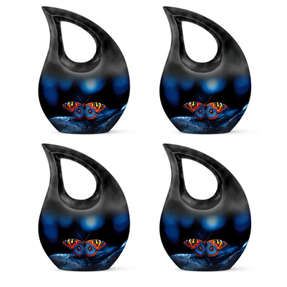 Dark Black Butterfly Cremation Urn lifestyle display on memorial shelf - faith-inspired cross-drop urn with butterfly pattern - 10 inch aluminum urn for cremated remains