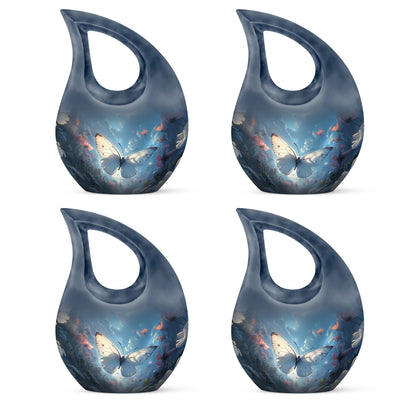 Celestial Blue Butterfly Cremation Urn lifestyle display on memorial shelf - sacred cross merged with butterfly motif on metal - 10 inch aluminum urn for cremated remains