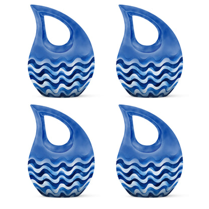 Royal Blue Blue Cremation Urn lifestyle display on memorial shelf - faith-inspired cross-drop urn with blue pattern - 10 inch aluminum urn for cremated remains