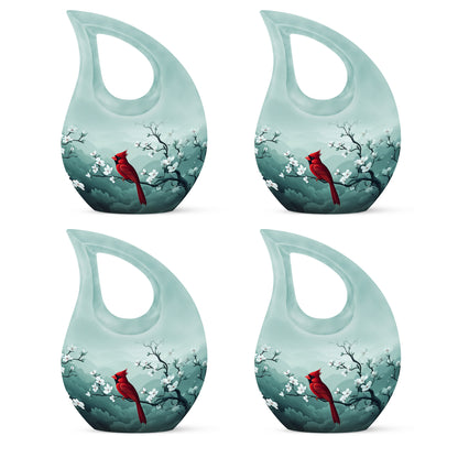 Brushed Silver Cardinal Cremation Urn lifestyle display on memorial shelf - sacred cross merged with cardinal motif on metal - 10 inch aluminum urn for cremated remains