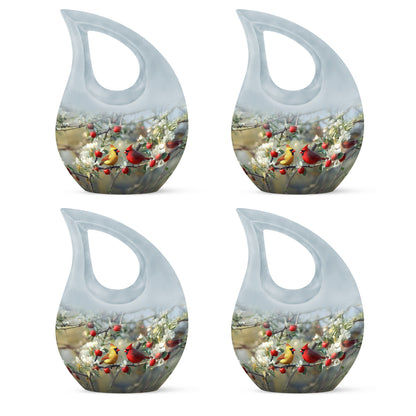 Polished Silver Cardinal Cremation Urn lifestyle display on memorial shelf - faith-inspired cross-drop urn with cardinal pattern - 10 inch aluminum urn for cremated remains