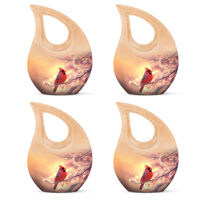 Sunrise Gold Cardinal Cremation Urn lifestyle display on memorial shelf - cross and cardinal combined in spiritual memorial design - 10 inch aluminum urn for cremated remains