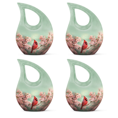 Mint Green Cardinal Cremation Urn lifestyle display on memorial shelf - devotional cross-drop cardinal engraving - 10 inch aluminum urn for cremated remains