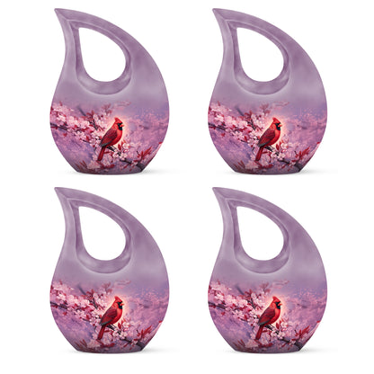 Dusty Pink Cardinal Cremation Urn lifestyle display on memorial shelf - faith-inspired cross-drop urn with cardinal pattern - 10 inch aluminum urn for cremated remains