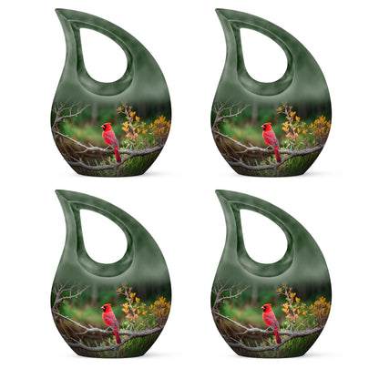 Moss Green Cardinal Cremation Urn lifestyle display on memorial shelf - cross and cardinal combined in spiritual memorial design - 10 inch aluminum urn for cremated remains