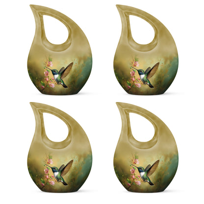 Burnished Gold Hummingbird Cremation Urn lifestyle display on memorial shelf - devotional cross-drop hummingbird engraving - 10 inch aluminum urn for cremated remains