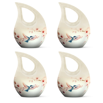 Pearl White Hummingbird Cremation Urn lifestyle display on memorial shelf - devotional cross-drop hummingbird engraving - 10 inch aluminum urn for cremated remains