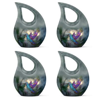 Hunter Green Hummingbird Cremation Urn lifestyle display on memorial shelf - faith-inspired cross-drop urn with hummingbird pattern - 10 inch aluminum urn for cremated remains