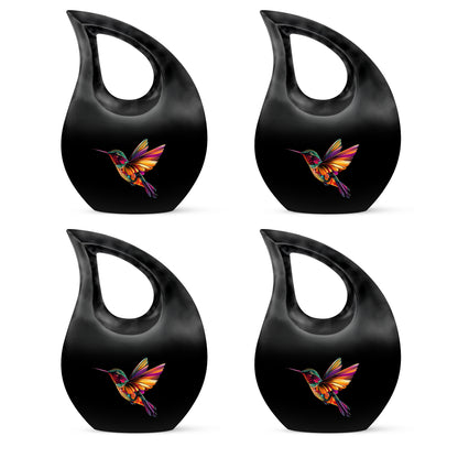 Dark Black Hummingbird Cremation Urn lifestyle display on memorial shelf - faith-inspired cross-drop urn with hummingbird pattern - 10 inch aluminum urn for cremated remains