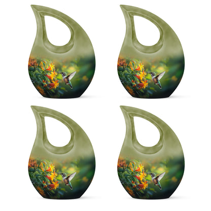 Forest Green Hummingbird Cremation Urn lifestyle display on memorial shelf - devotional cross-drop hummingbird engraving - 10 inch aluminum urn for cremated remains