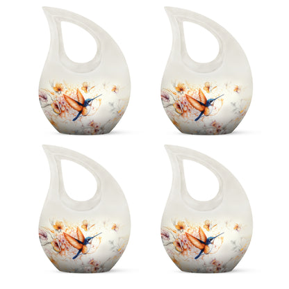 Mist Gray Hummingbird Cremation Urn lifestyle display on memorial shelf - cross and hummingbird combined in spiritual memorial design - 10 inch aluminum urn for cremated remains