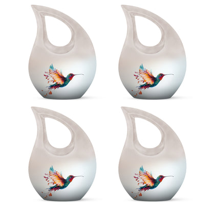 Moonlight Silver Hummingbird Cremation Urn lifestyle display on memorial shelf - devotional cross-drop hummingbird engraving - 10 inch aluminum urn for cremated remains