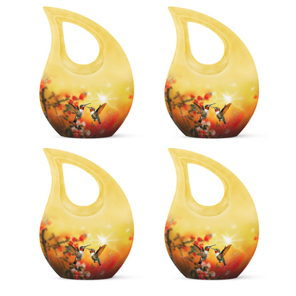 Harvest Gold Hummingbird Cremation Urn lifestyle display on memorial shelf - devotional cross-drop hummingbird engraving - 10 inch aluminum urn for cremated remains