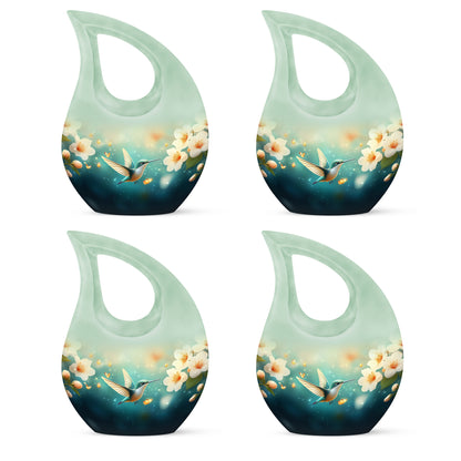 Tropical Teal Hummingbird Cremation Urn lifestyle display on memorial shelf - faith-inspired cross-drop urn with hummingbird pattern - 10 inch aluminum urn for cremated remains