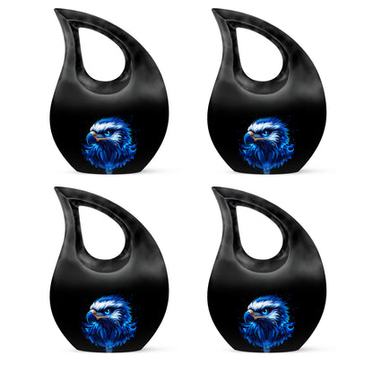 Deep Black Eagle Cremation Urn lifestyle display on memorial shelf - sacred cross merged with eagle motif on metal - 10 inch aluminum urn for cremated remains