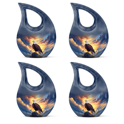 Indigo Eagle Cremation Urn lifestyle display on memorial shelf - sacred cross merged with eagle motif on metal - 10 inch aluminum urn for cremated remains