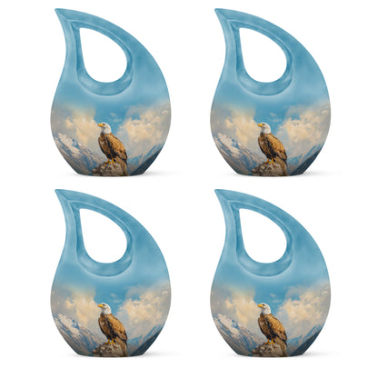 Soft Blue Eagle Cremation Urn lifestyle display on memorial shelf - faith-inspired cross-drop urn with eagle pattern - 10 inch aluminum urn for cremated remains