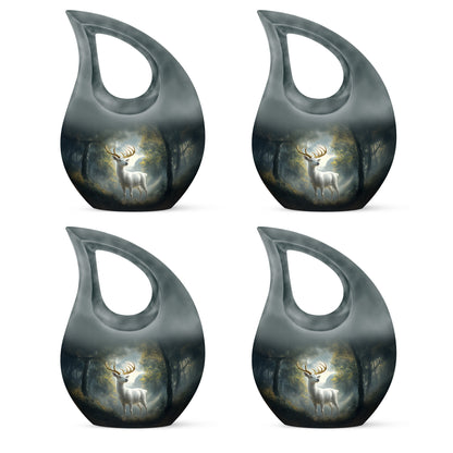Rich Black Deer Cremation Urn lifestyle display on memorial shelf - sacred cross merged with deer motif on metal - 10 inch aluminum urn for cremated remains