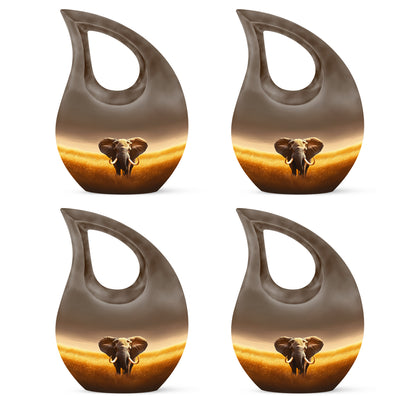 Matte Gold Elephant Cremation Urn lifestyle display on memorial shelf - faith-inspired cross-drop urn with elephant pattern - 10 inch aluminum urn for cremated remains