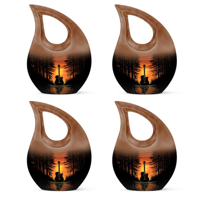 Obsidian Black Guitar Cremation Urn lifestyle display on memorial shelf - devotional cross-drop guitar engraving - 10 inch aluminum urn for cremated remains