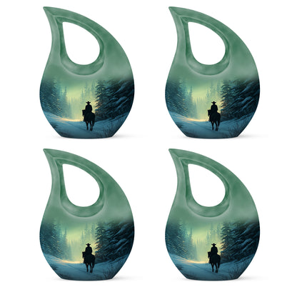 Sage Green Cowboy Cremation Urn lifestyle display on memorial shelf - cross and cowboy combined in spiritual memorial design - 10 inch aluminum urn for cremated remains