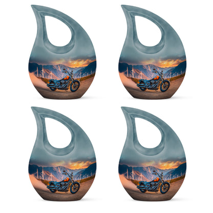 Jewel Teal Bike Cremation Urn lifestyle display on memorial shelf - sacred cross merged with bike motif on metal - 10 inch aluminum urn for cremated remains