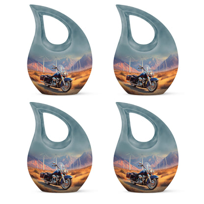 Sunrise Gold Bike Cremation Urn lifestyle display on memorial shelf - cross and bike combined in spiritual memorial design - 10 inch aluminum urn for cremated remains
