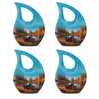 Mystic Teal Bike Cremation Urn lifestyle display on memorial shelf - devotional cross-drop bike engraving - 10 inch aluminum urn for cremated remains