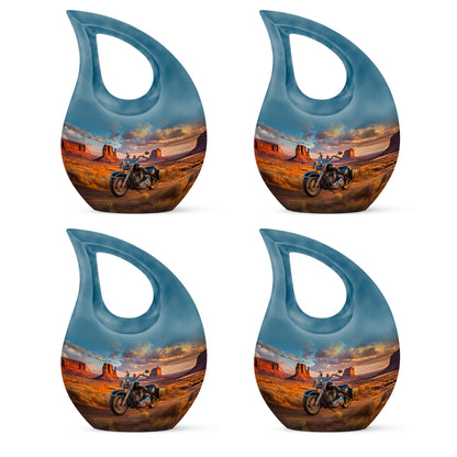 Celestial Blue Bike Cremation Urn lifestyle display on memorial shelf - sacred cross merged with bike motif on metal - 10 inch aluminum urn for cremated remains