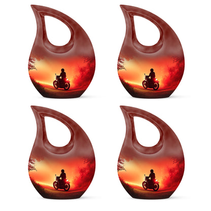 Wine Red Bike Cremation Urn lifestyle display on memorial shelf - cross and bike combined in spiritual memorial design - 10 inch aluminum urn for cremated remains