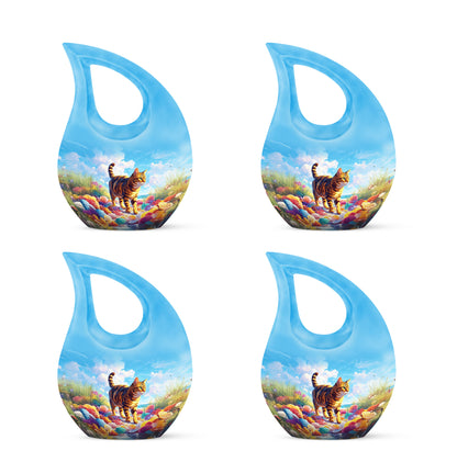 Dusty Blue Cat Cremation Urn lifestyle display on memorial shelf - sacred cross merged with cat motif on metal - 10 inch aluminum urn for cremated remains