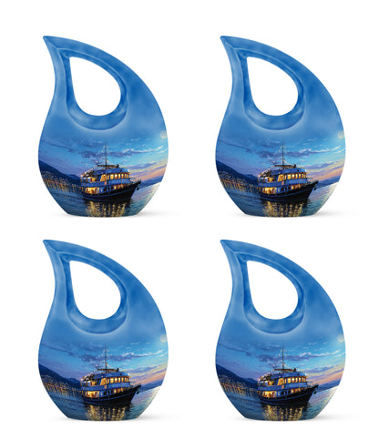 Celestial Blue Boat Cremation Urn lifestyle display on memorial shelf - sacred cross merged with boat motif on metal - 10 inch aluminum urn for cremated remains