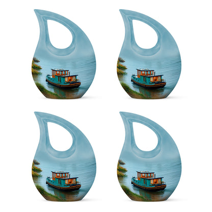 Cool Teal Boat Cremation Urn lifestyle display on memorial shelf - sacred cross merged with boat motif on metal - 10 inch aluminum urn for cremated remains