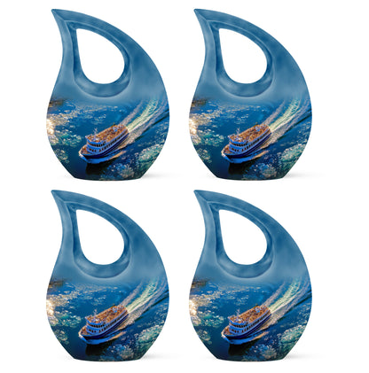 Cobalt Blue Boat Cremation Urn lifestyle display on memorial shelf - faith-inspired cross-drop urn with boat pattern - 10 inch aluminum urn for cremated remains