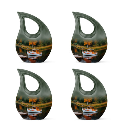 Forest Green Boat Cremation Urn lifestyle display on memorial shelf - devotional cross-drop boat engraving - 10 inch aluminum urn for cremated remains