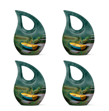 Ocean Teal Boat Cremation Urn lifestyle display on memorial shelf - cross and boat combined in spiritual memorial design - 10 inch aluminum urn for cremated remains