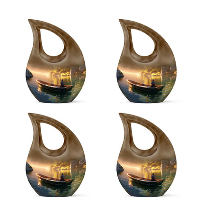 Antique Gold Boat Cremation Urn lifestyle display on memorial shelf - sacred cross merged with boat motif on metal - 10 inch aluminum urn for cremated remains