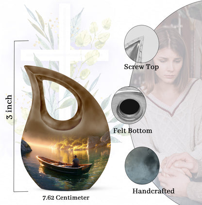 Sunrise Gold Boat Cremation Urn back view with polished surface - sacred cross merged with boat motif on metal - mini keepsake memorial for portion of cremation ashes