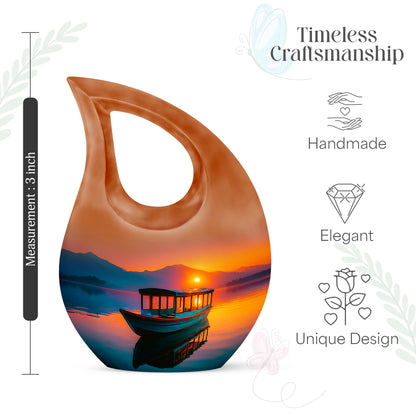 Wine Red Boat Cremation Urn back view with polished surface - sacred cross merged with boat motif on metal - mini keepsake memorial for portion of cremation ashes